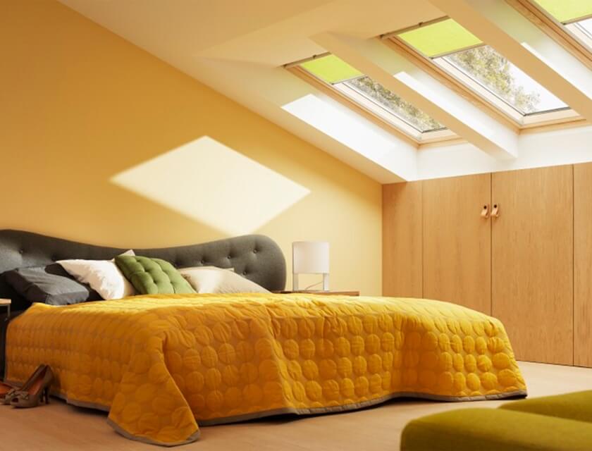 Yellow skylight blinds in bedroom