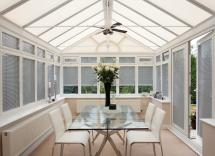 White pleated blinds in conservatory